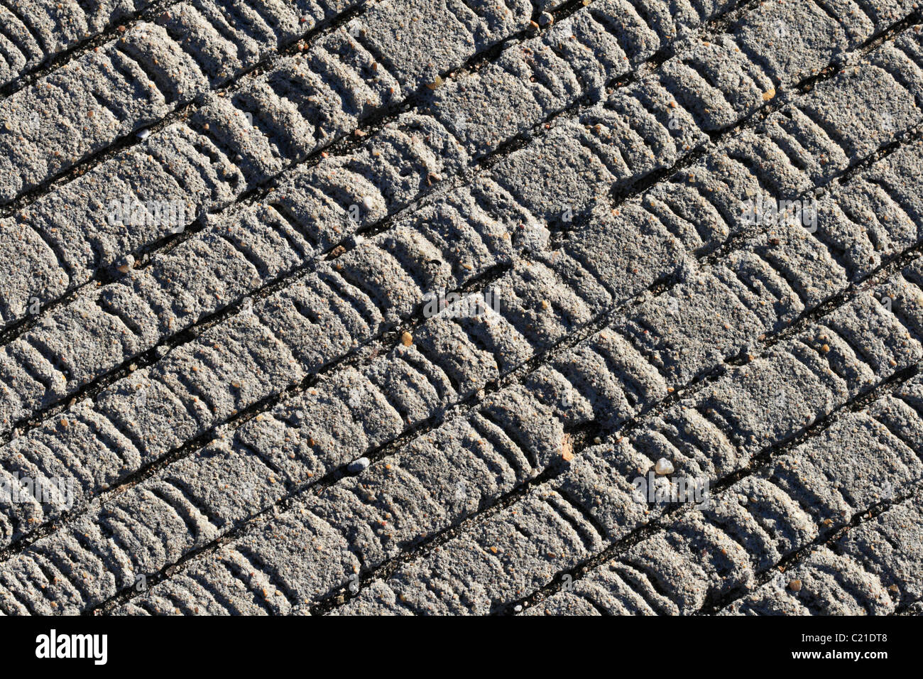 textured concrete background with diagonal grooves to increase traction Stock Photo