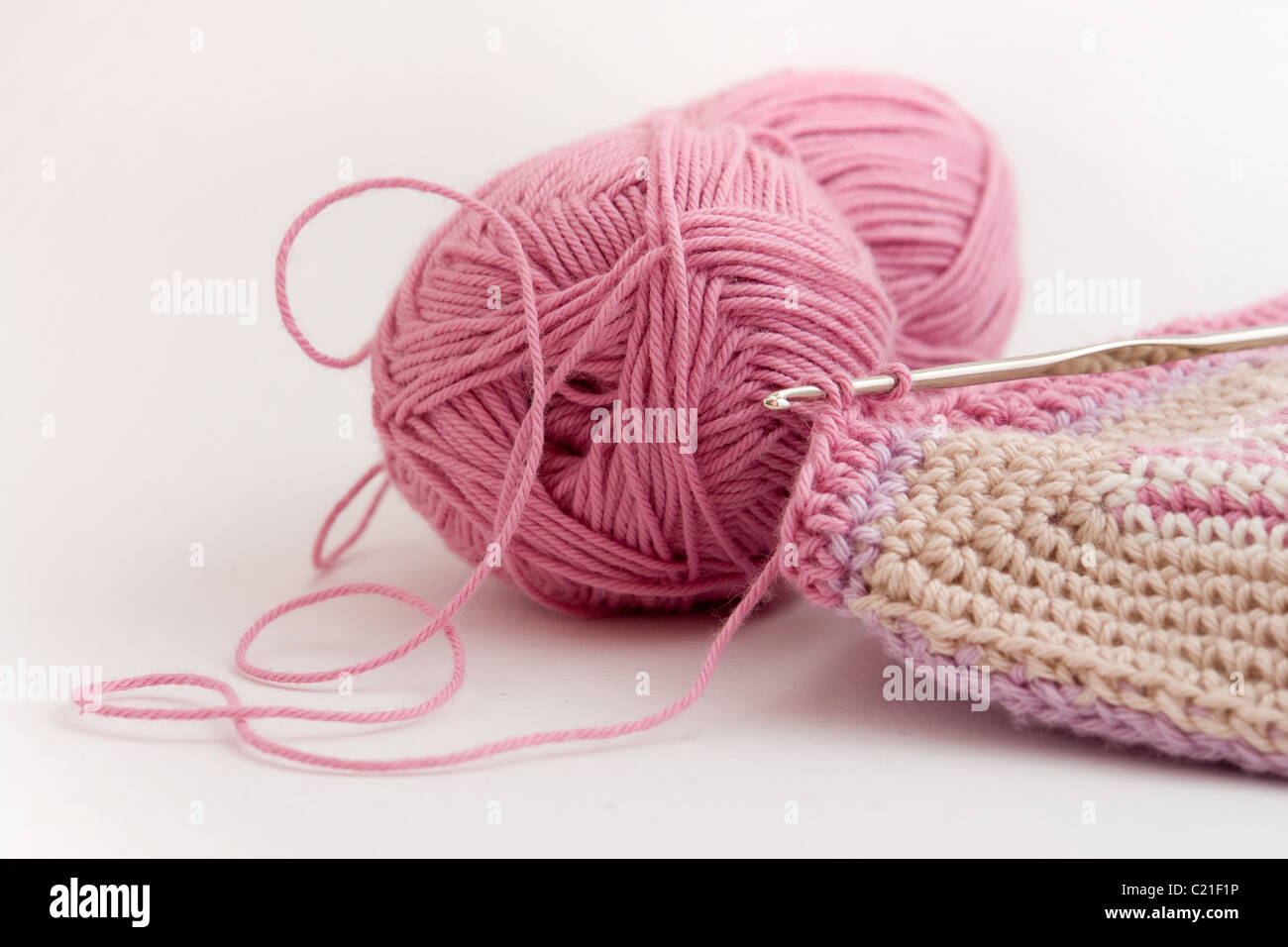 Pink yarn ball and crochet handicraft details Stock Photo Alamy