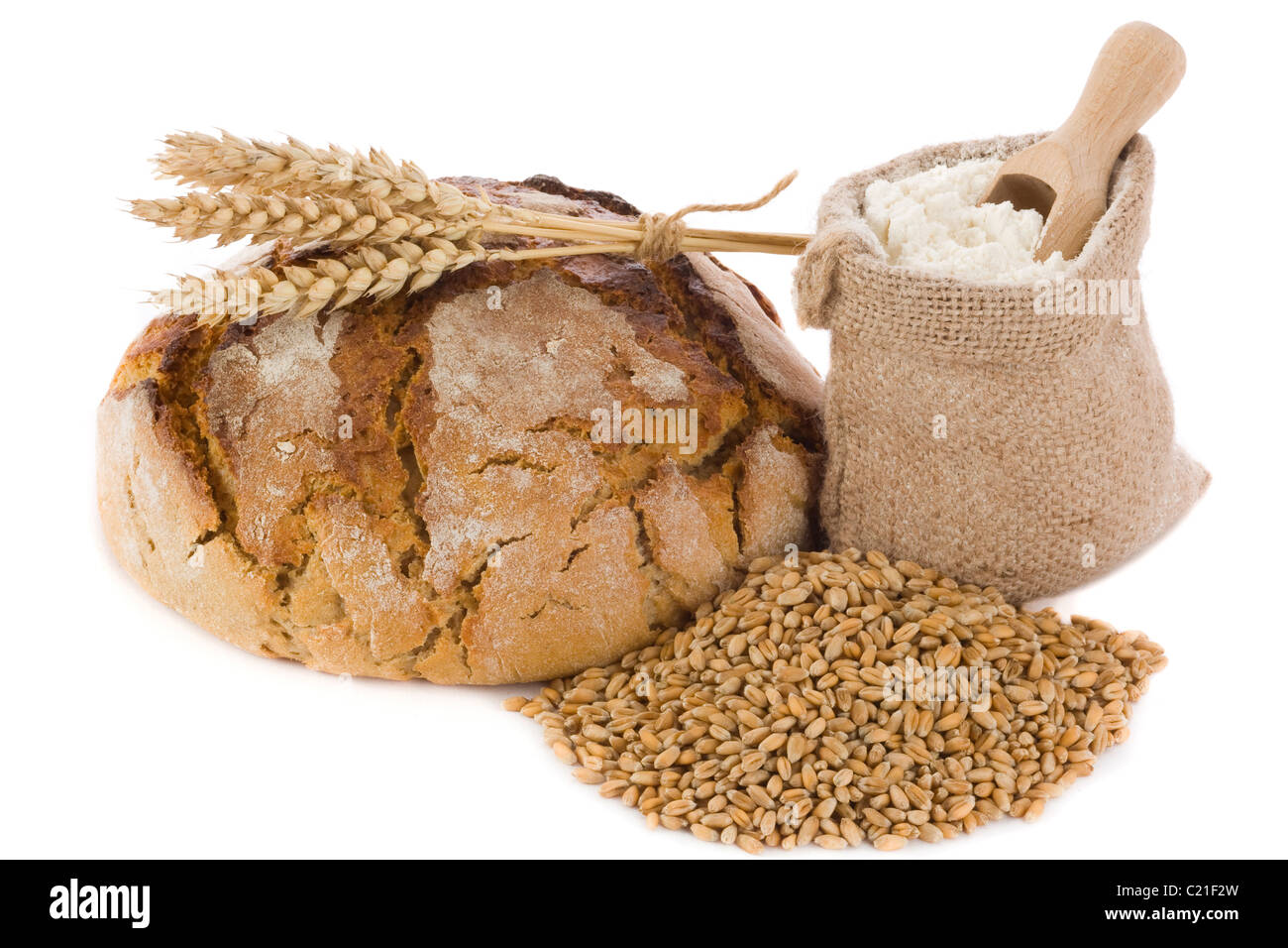 Fresh bread, wheat grain and flour in small burlap sack Stock Photo