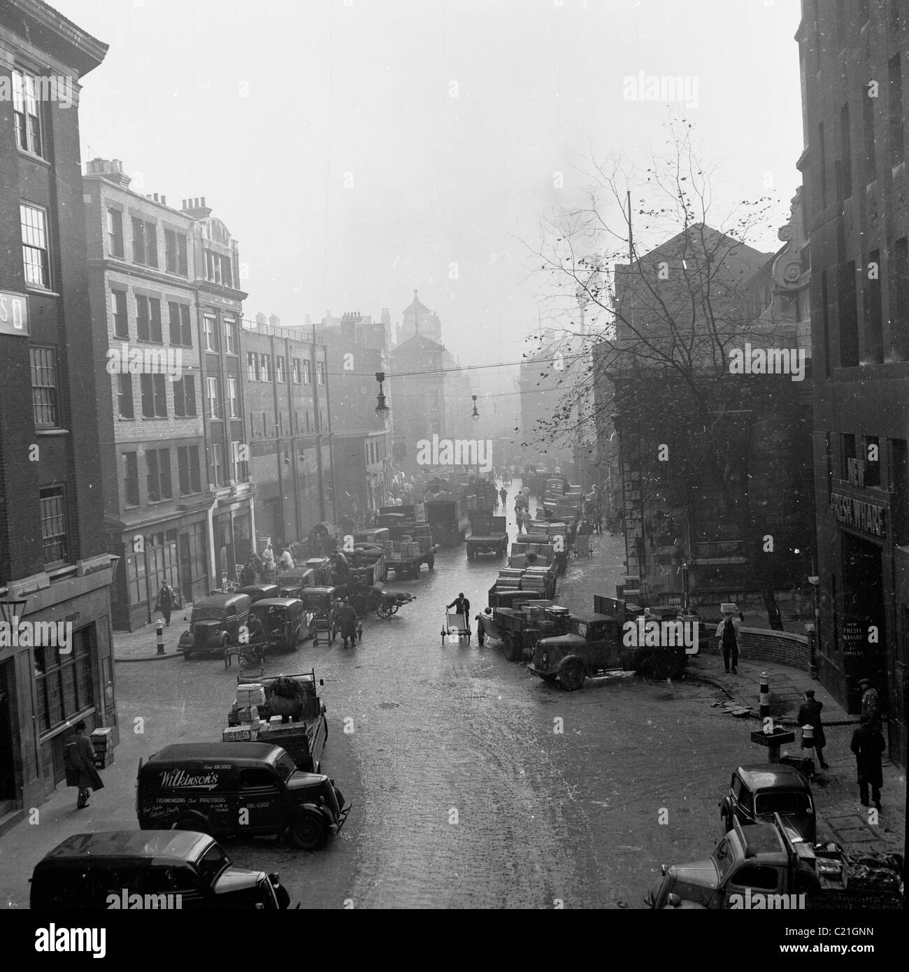 1950s, England. View down a busy market street, near St Martins Lane, London in this historical picture by J Allan Cash. Stock Photo