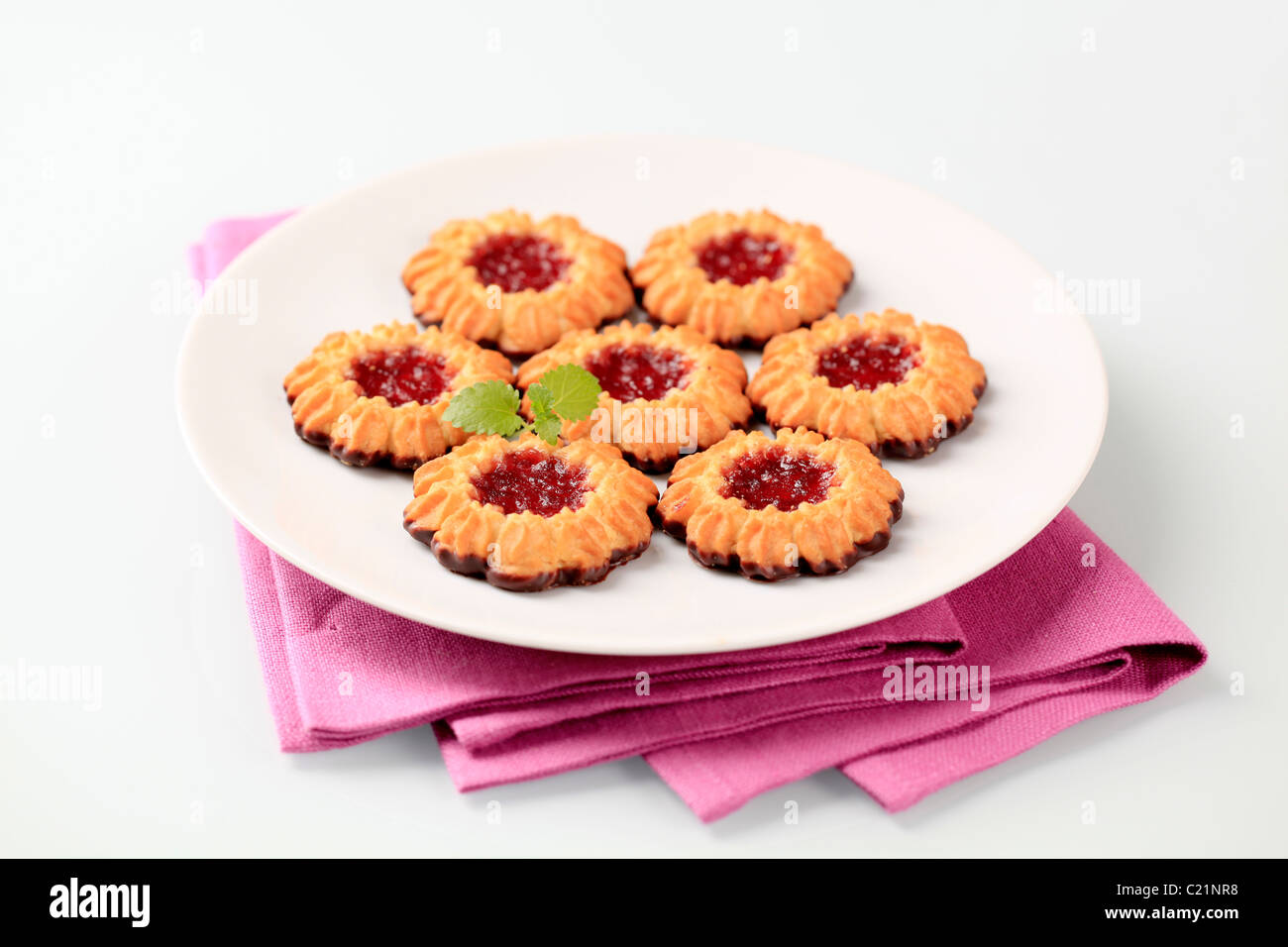 Chocolate dipped butter cookies with jelly center Stock Photo Alamy