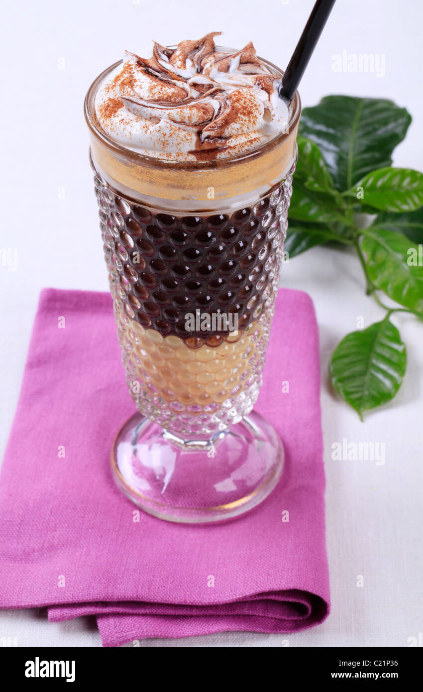 Liqueur coffee with whipped cream and chocolate sauce Stock Photo Alamy