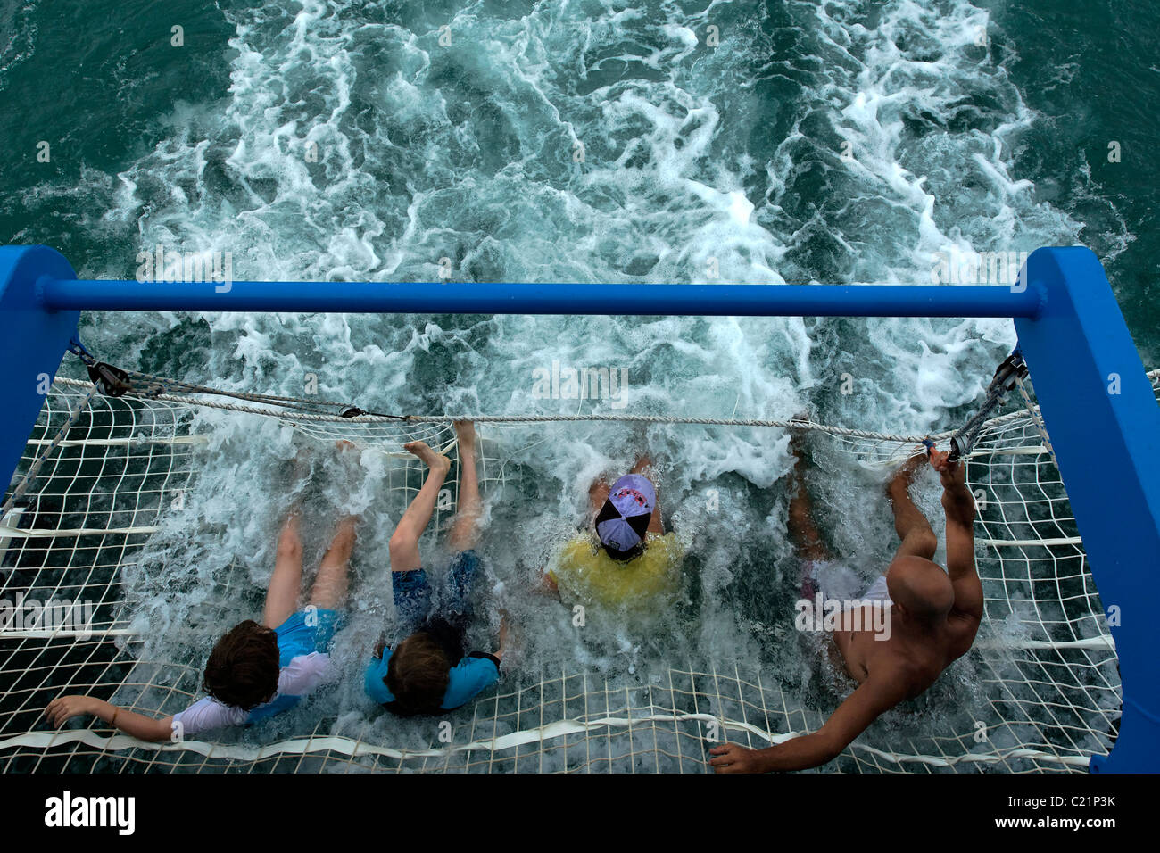 Tourists riding in a Boom Net at the stern of a Boat, Shark Bay Western Australia Stock Photo