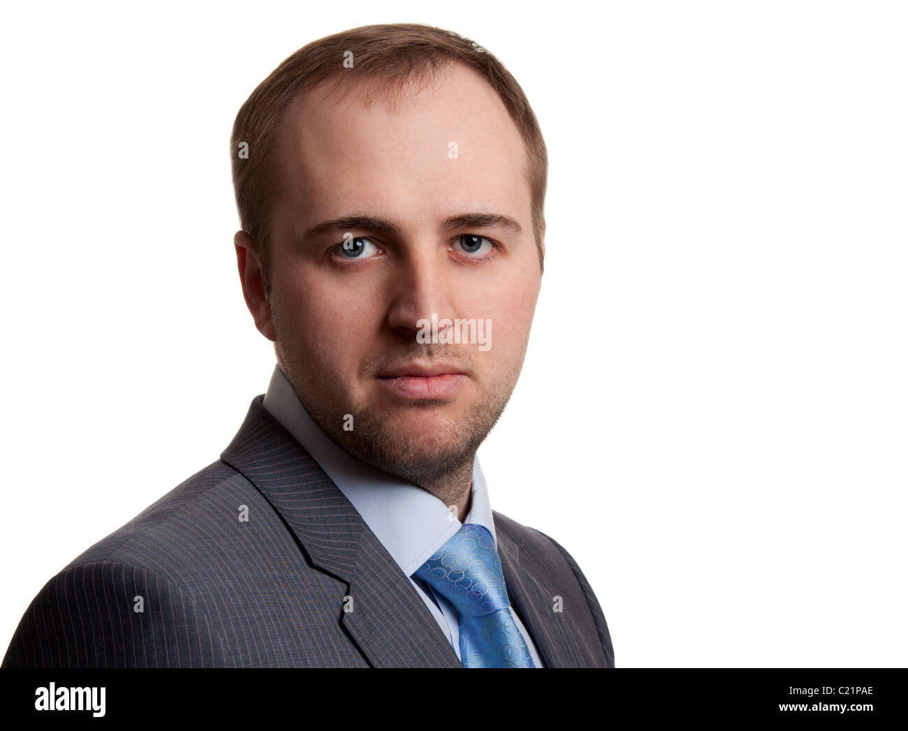 portrait of an unshaven businessman in a gray suit with a white ...