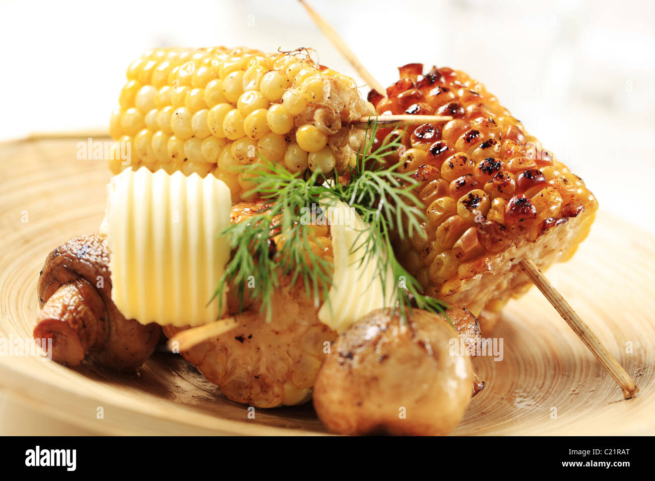 Roasted sweet corn cobs and button mushrooms Stock Photo Alamy
