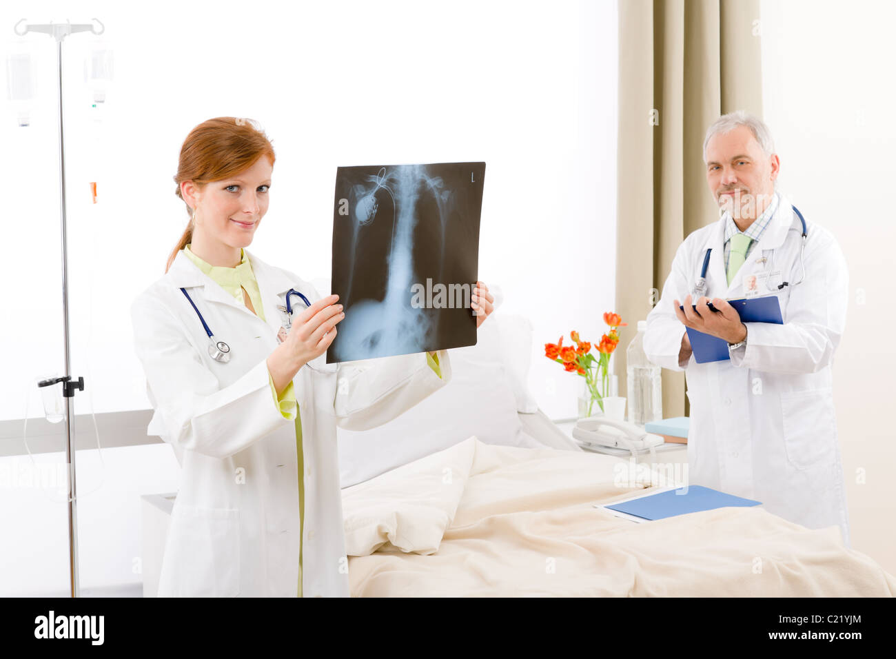 Medical team - portrait of two doctor with x-ray in hospital Stock Photo