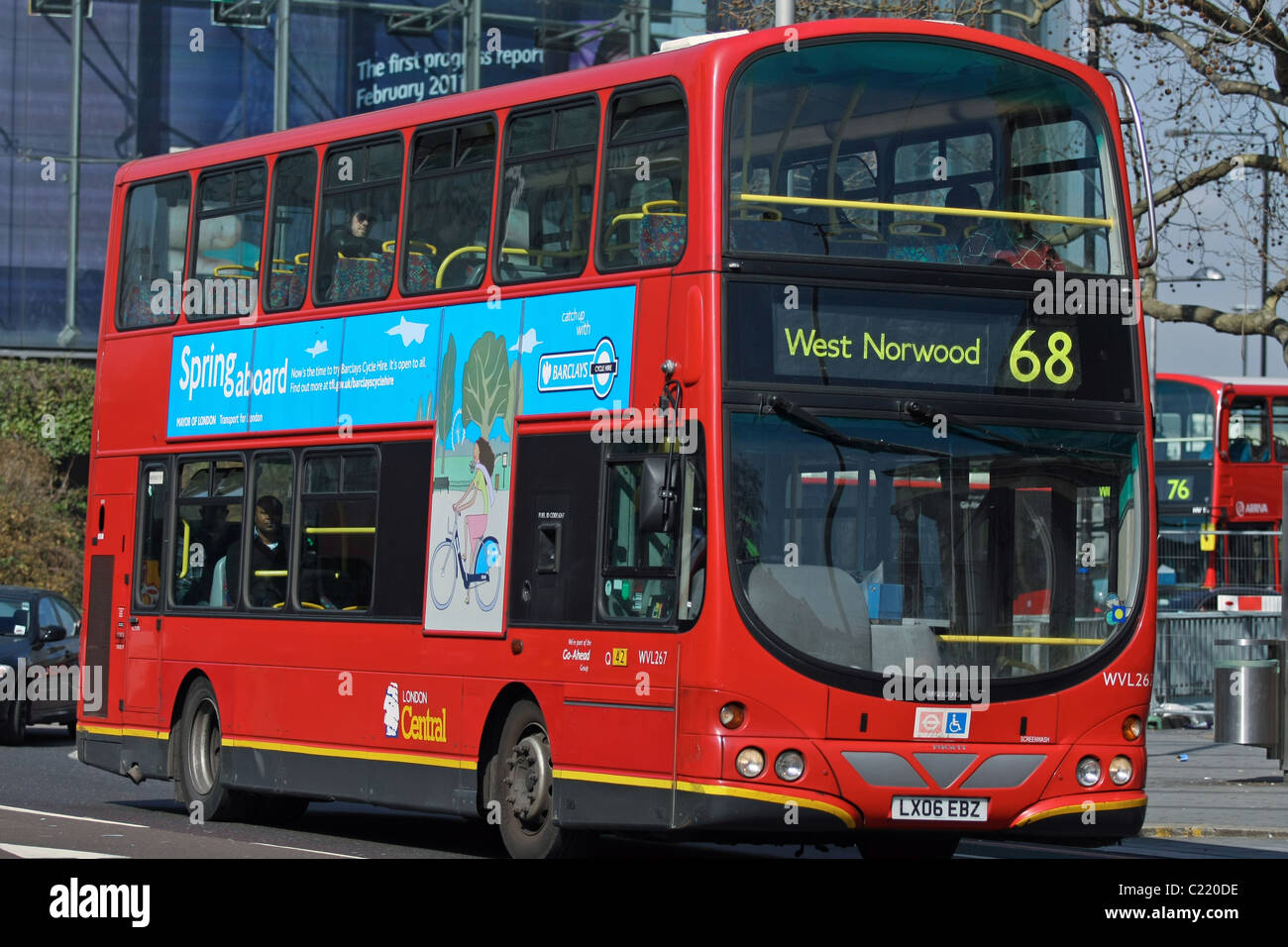 A double decker red London bus traveling on its route through Waterloo, London, England Stock Photo