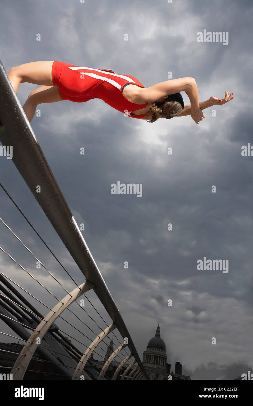 High Jumper jumping over Millennium Bridge Stock Photo Alamy