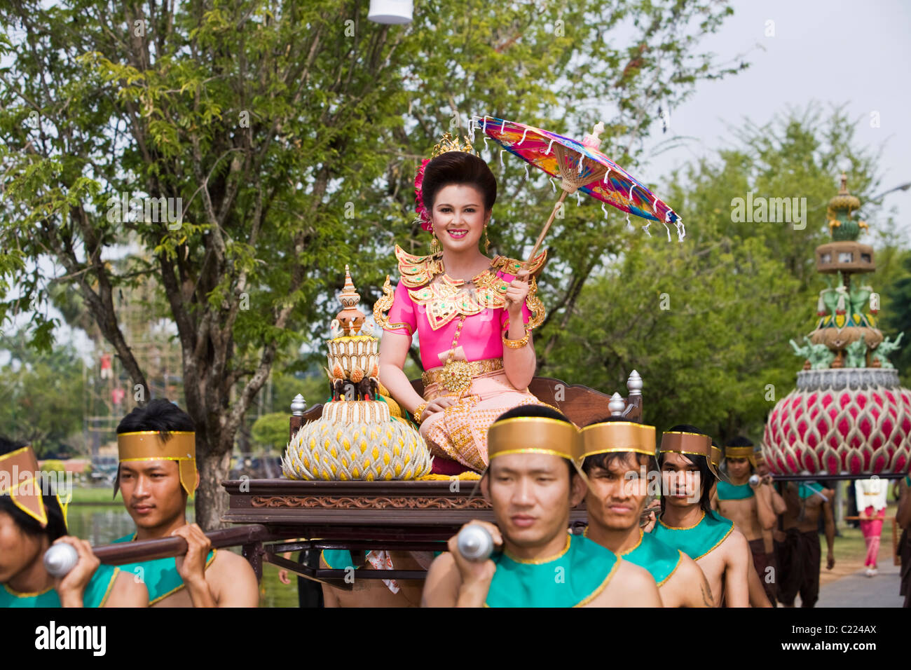 Parade through Sukhothai Historical Park during the festival of Loi Krathong.  Sukhothai, Sukhothai, Thailand Stock Photo