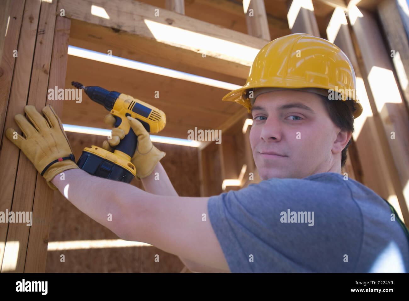 Labourer works on building construction Stock Photo