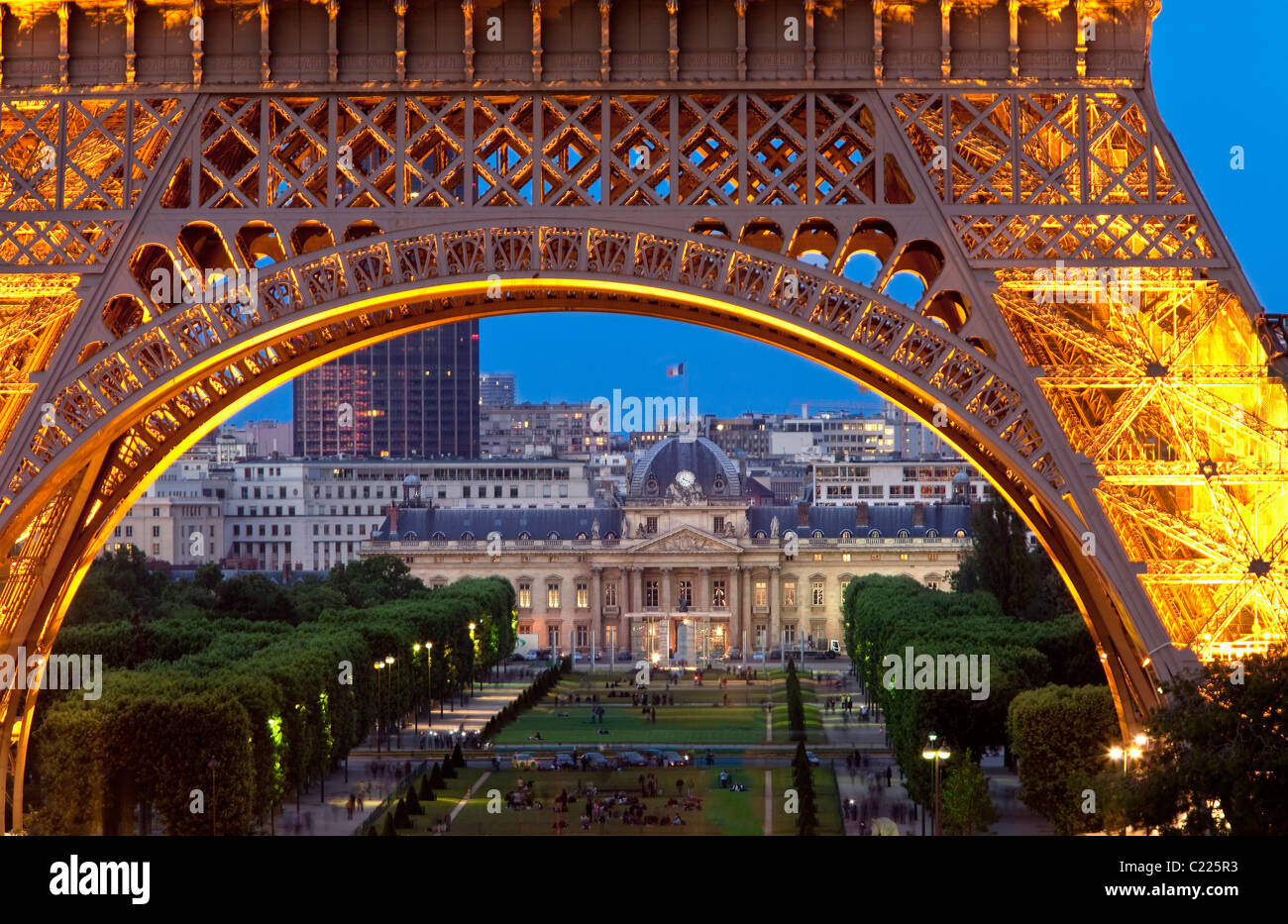 Eiffel Tower with Ecole Militaire beyond at night, Paris France Stock Photo