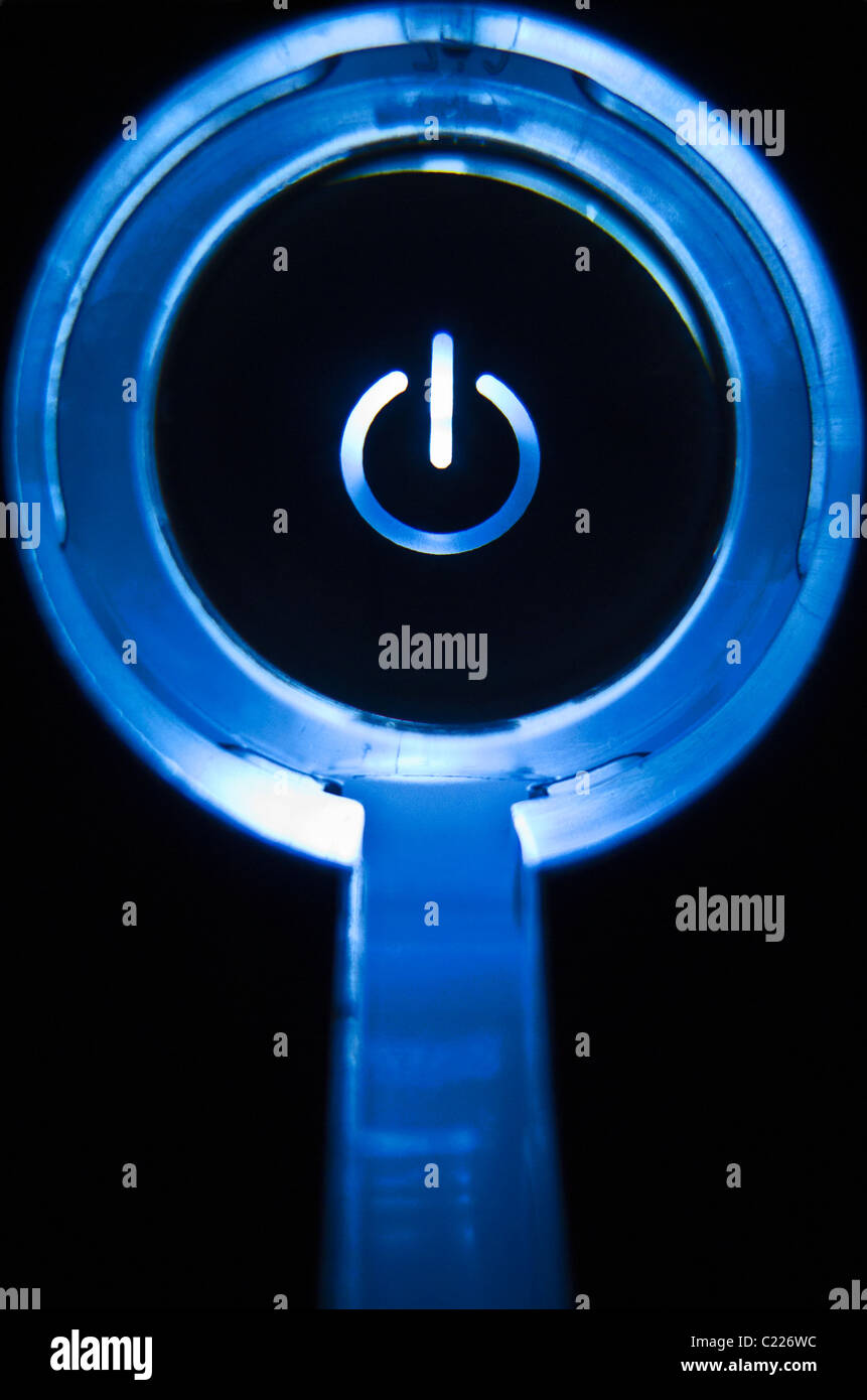 Power/standby switch lit up blue Stock Photo Alamy