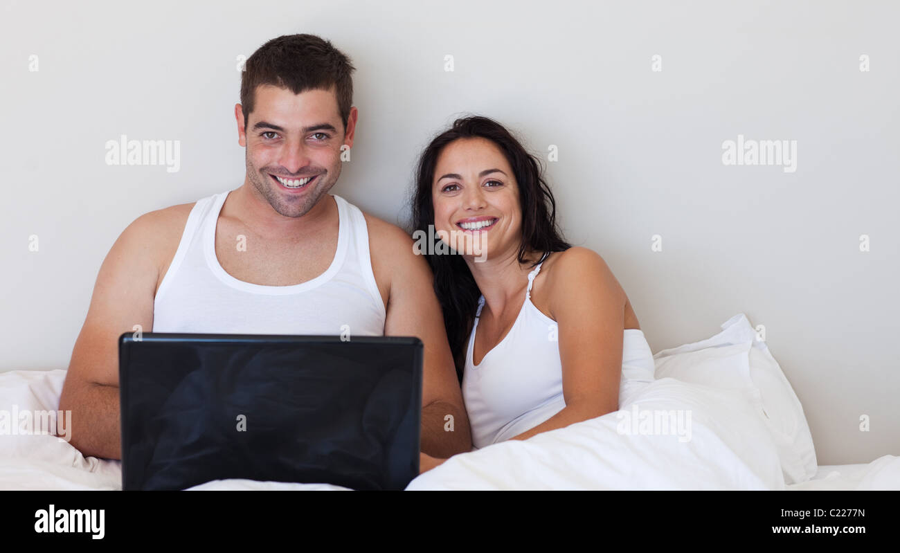 Happy couple in love smiling at the camera Stock Photo - Alamy