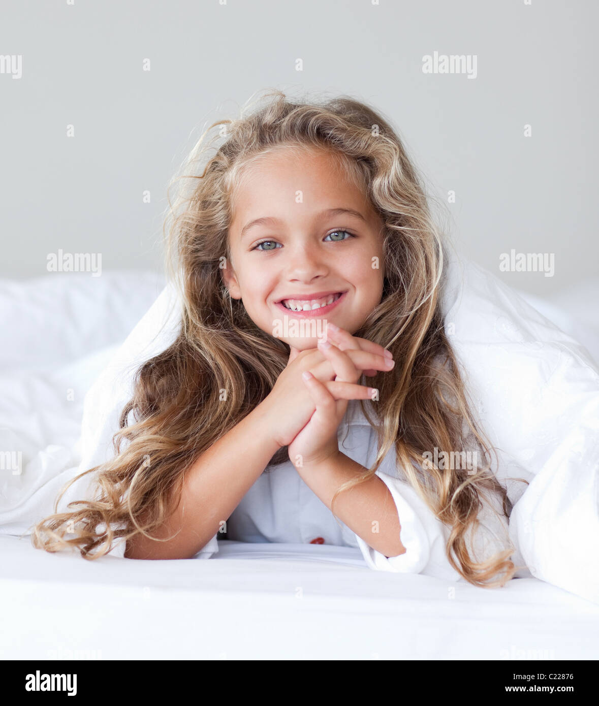 Portrait of happy little girl with blond hair Stock Photo - Alamy