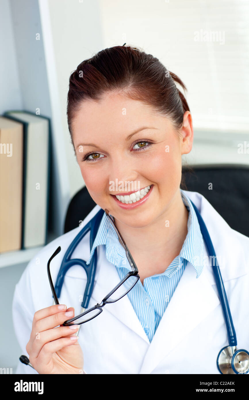 Happy smiling doctor sitting hi-res stock photography and images - Alamy
