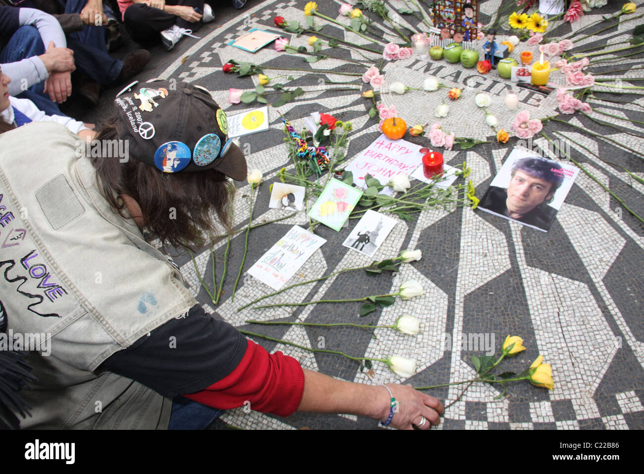Fans pay tribute to the late John Lennon on what would have been the Beatle's 69th birthday. The gathering took place at the Stock Photo
