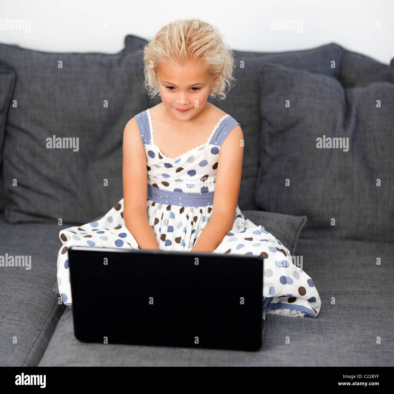 Cute girl with a laptop Stock Photo - Alamy