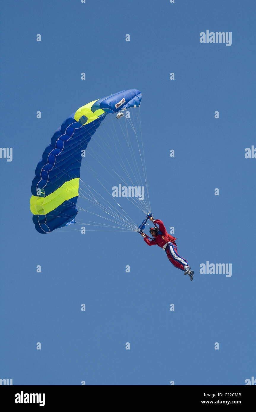 Skydiver jumper landing a square ram air parachute Stock Photo
