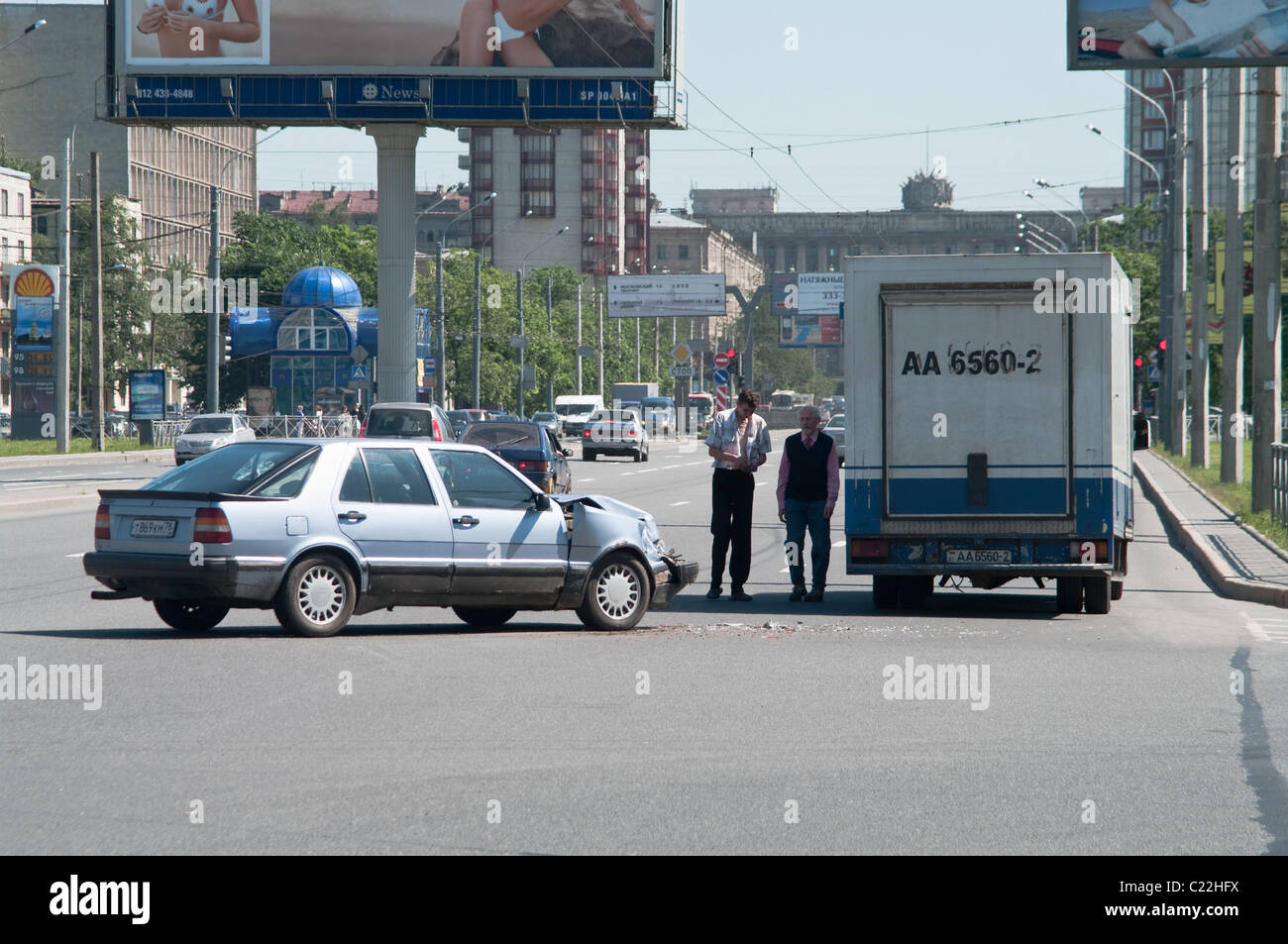 Car accident on the road, two vehicles collided, drivers looking at damage. Saint-Petersburg, Russia Stock Photo
