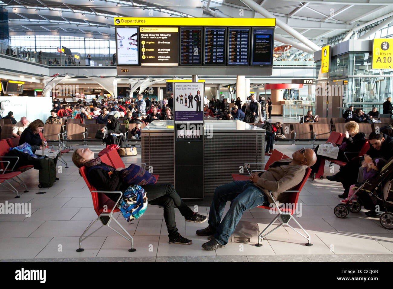 Air travellers sleeping in the departure lounge, terminal 5, Heathrow