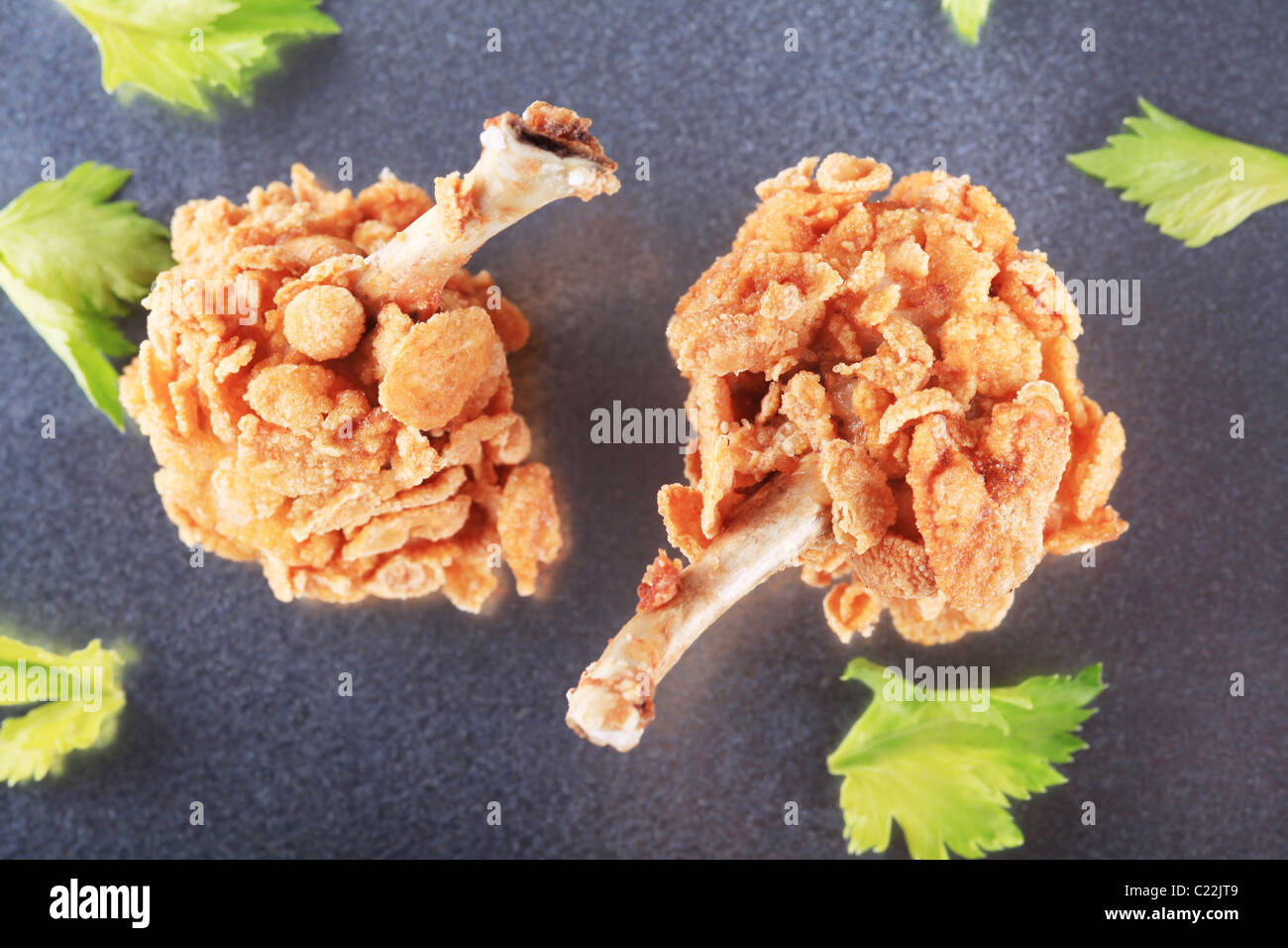 Chicken drumsticks coated with corn flakes closeup Stock Photo Alamy