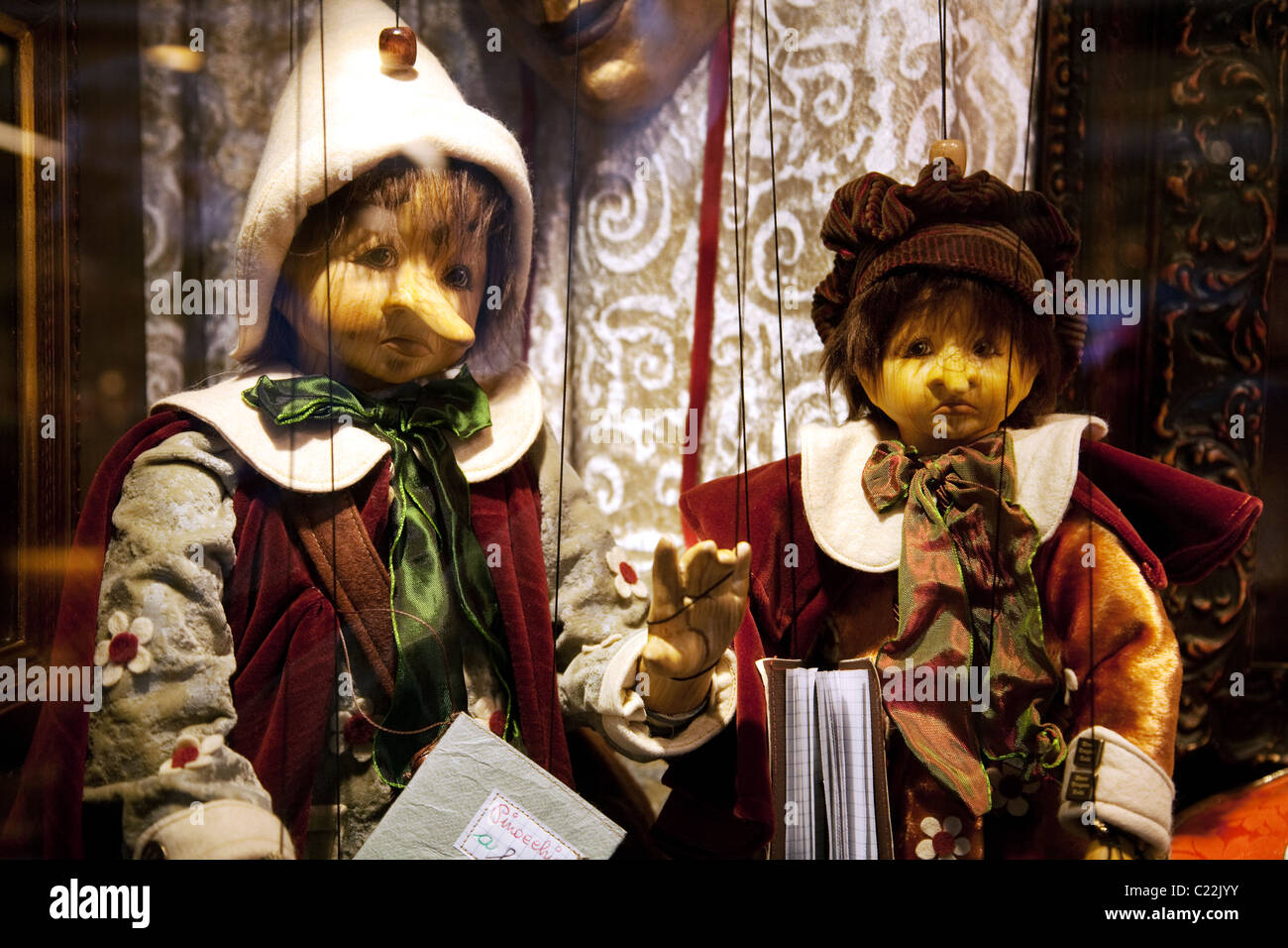 Wooden Pinocchio puppets for sale in a shop window, Venice Italy Europe Stock Photo