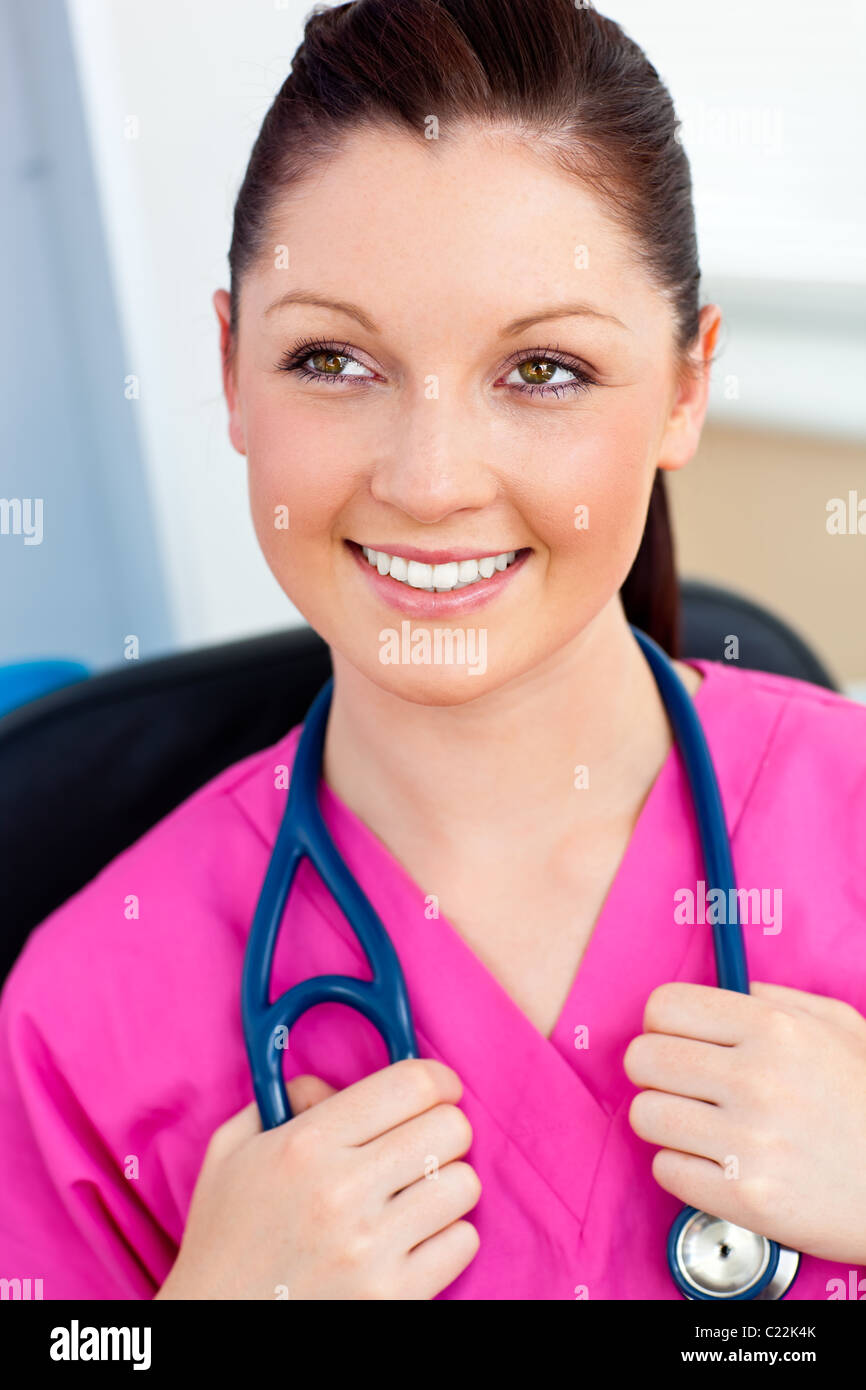 Pretty female surgeon smiling at the camera Stock Photo - Alamy