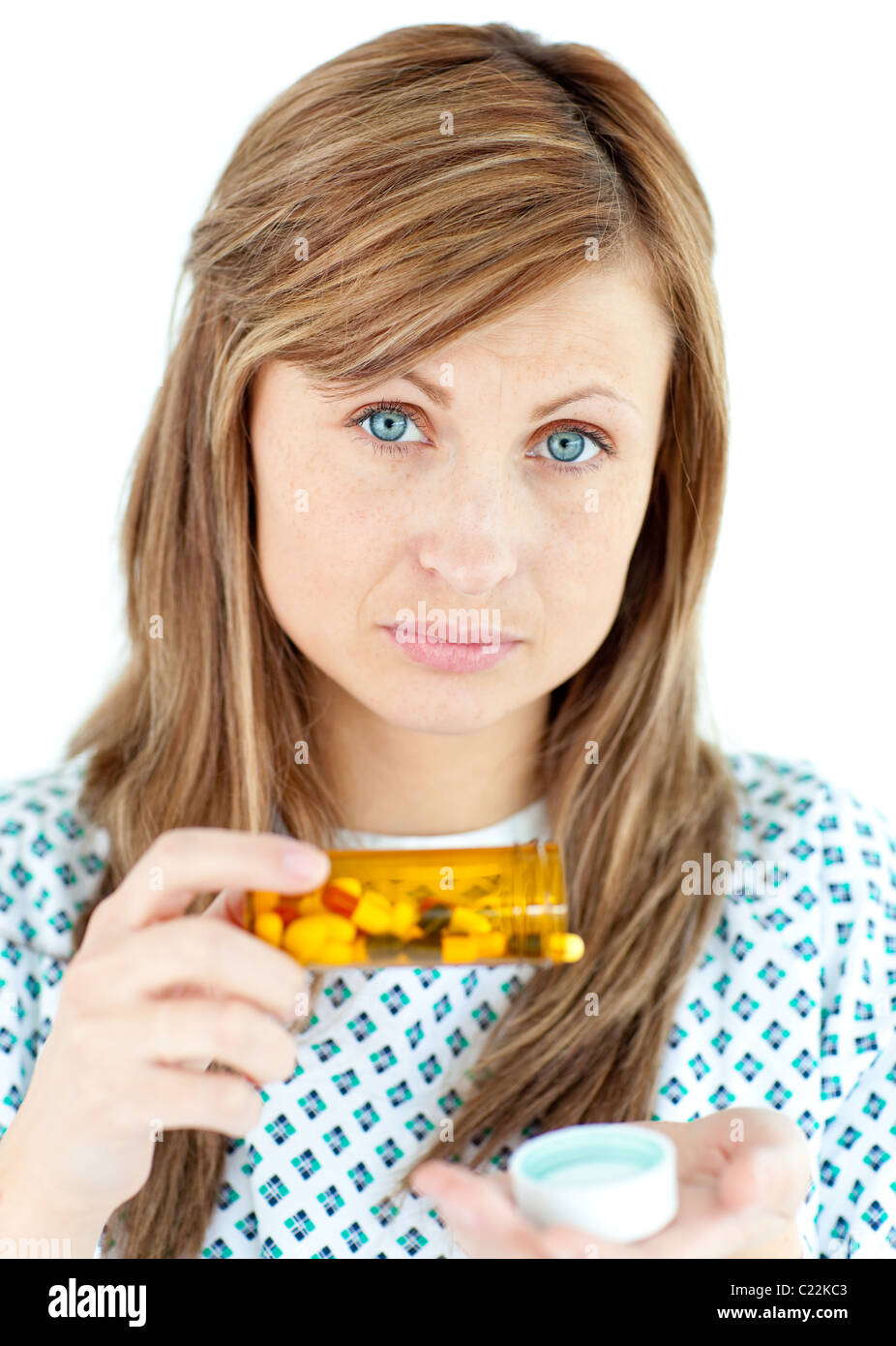 Diseased woman taking pills Stock Photo
