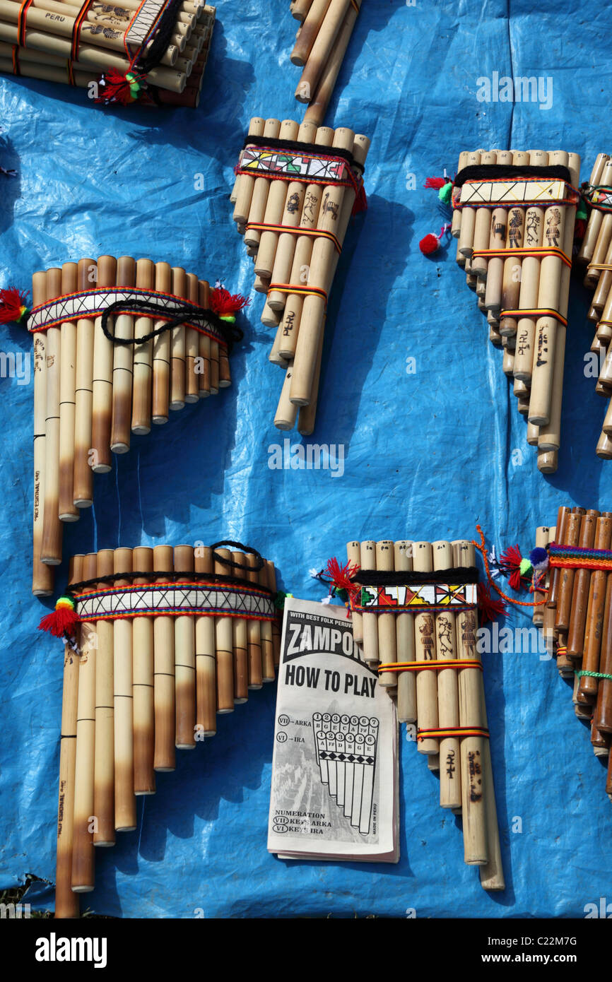 Panpipes with instruction book for learning how to play them for sale in Chinchero market , Sacred Valley , near Cusco , Peru Stock Photo