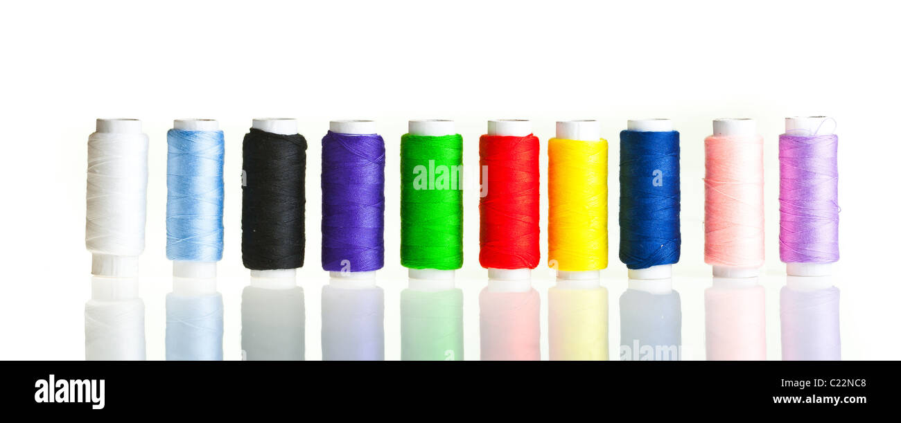 Colorful sewing threads and tools on white isolated background Stock ...