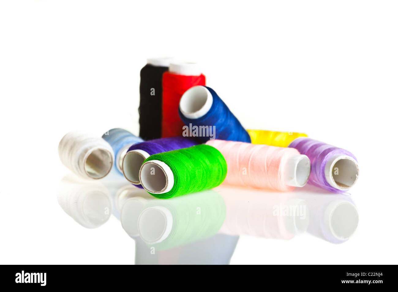 Colorful sewing threads and tools on white isolated background Stock ...