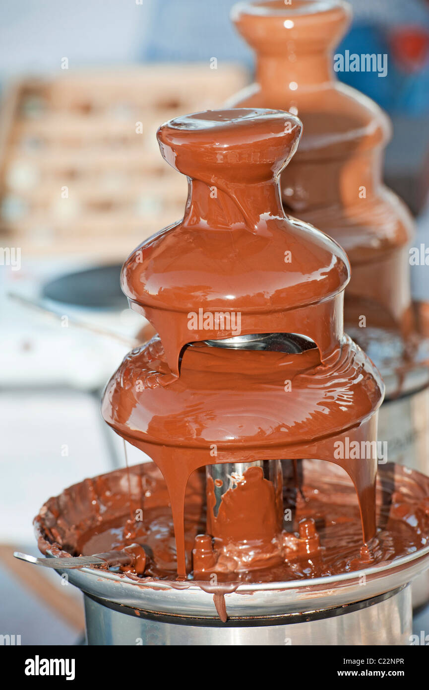 Dark chocolate fountain luxury dessert novelty at a restaurant Stock