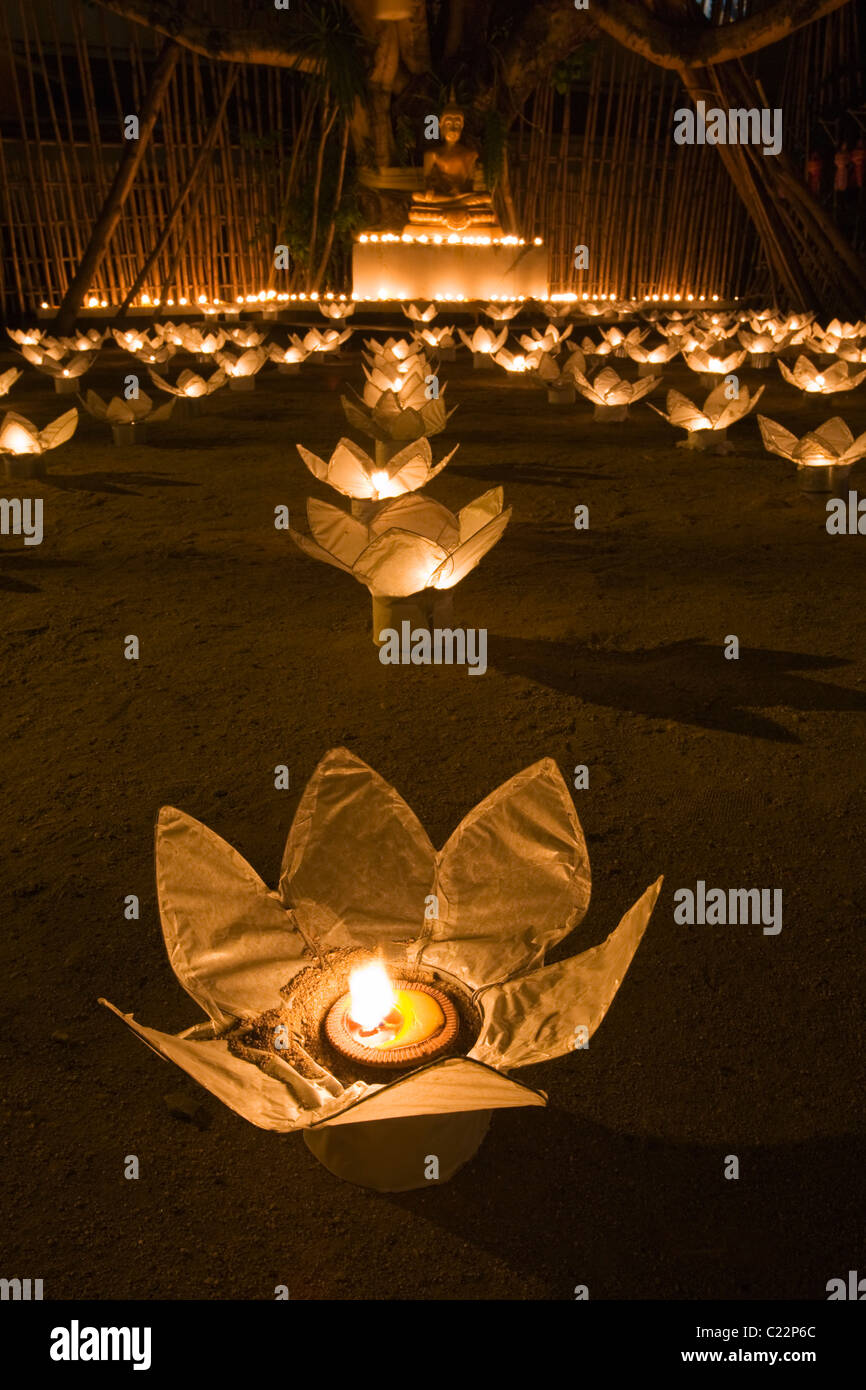 Buddha statue lit by candlelight at Wat Phan Tao during the festivals of Yi Peng and Loi Krathong.  Chiang Mai, Thailand Stock Photo