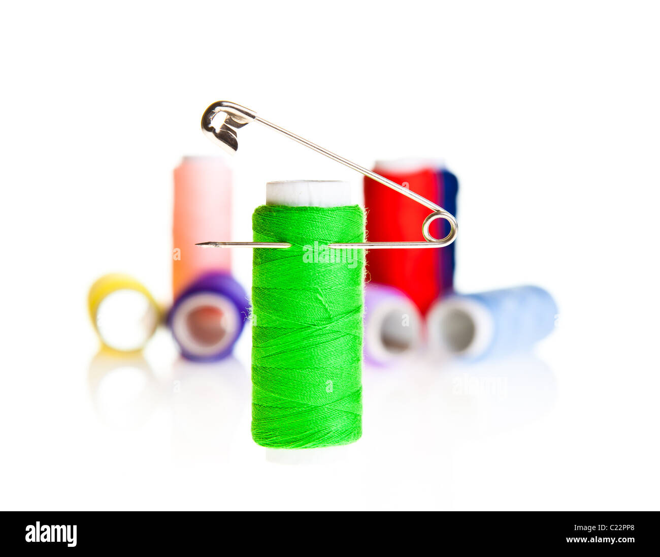 Colorful sewing threads and tools on white isolated background Stock ...