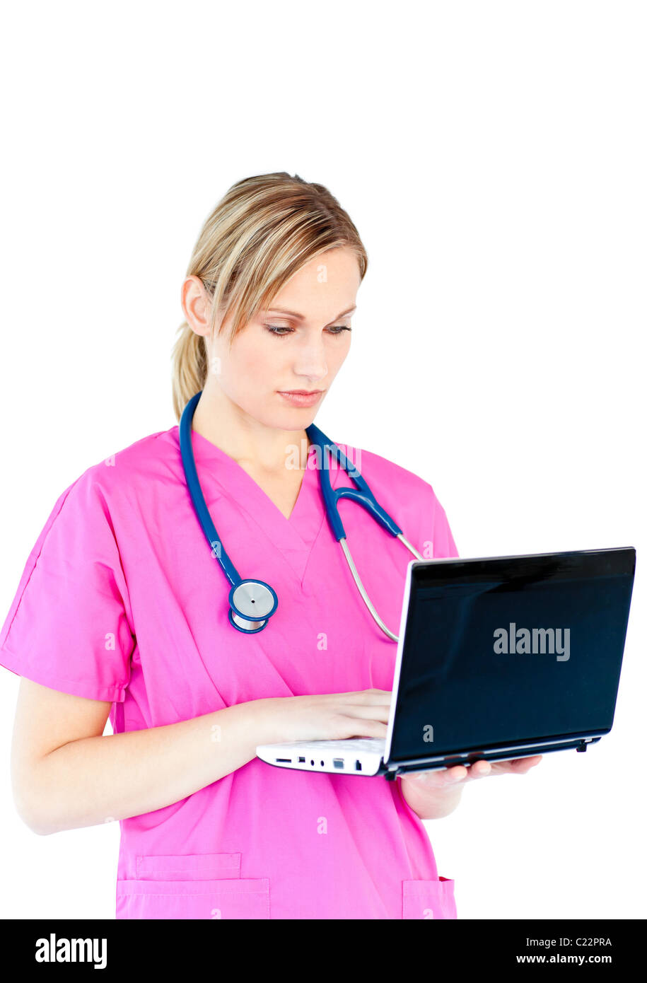 Concentrated female surgeon using a laptop Stock Photo
