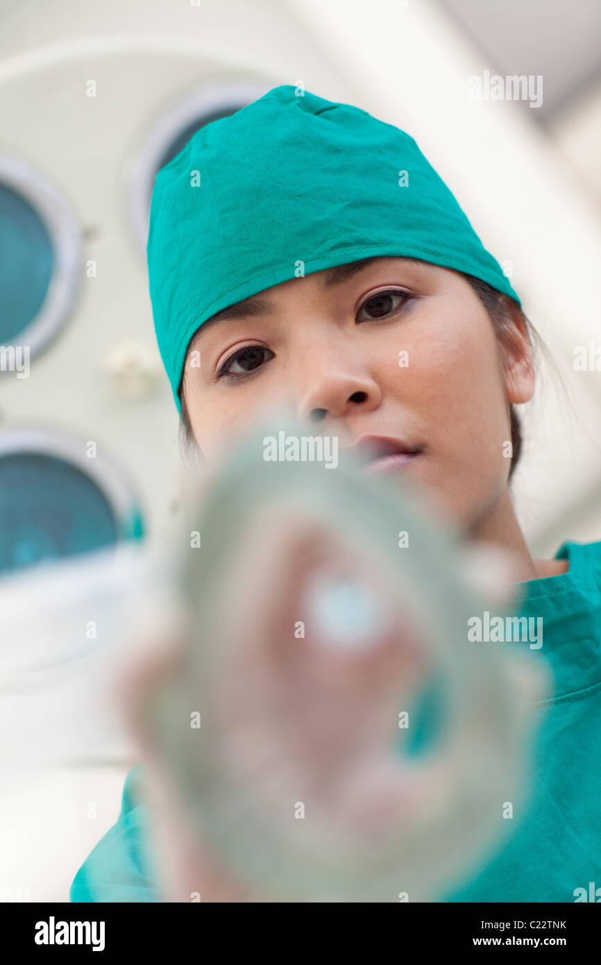 Serious nurse applying gas mask to a patient Stock Photo - Alamy