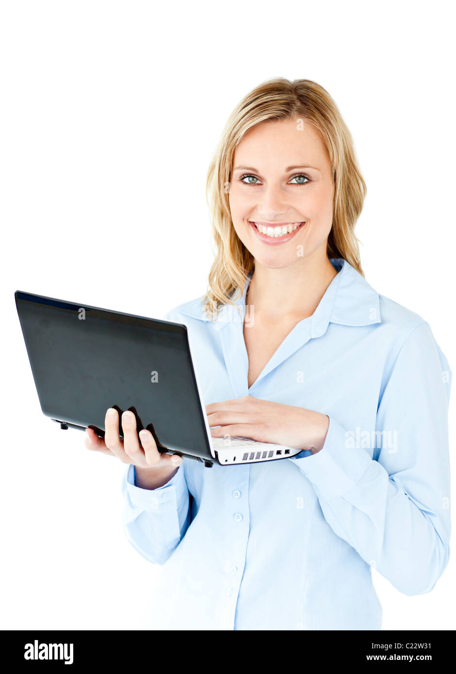 Jolly young businesswoman holding a laptop Stock Photo