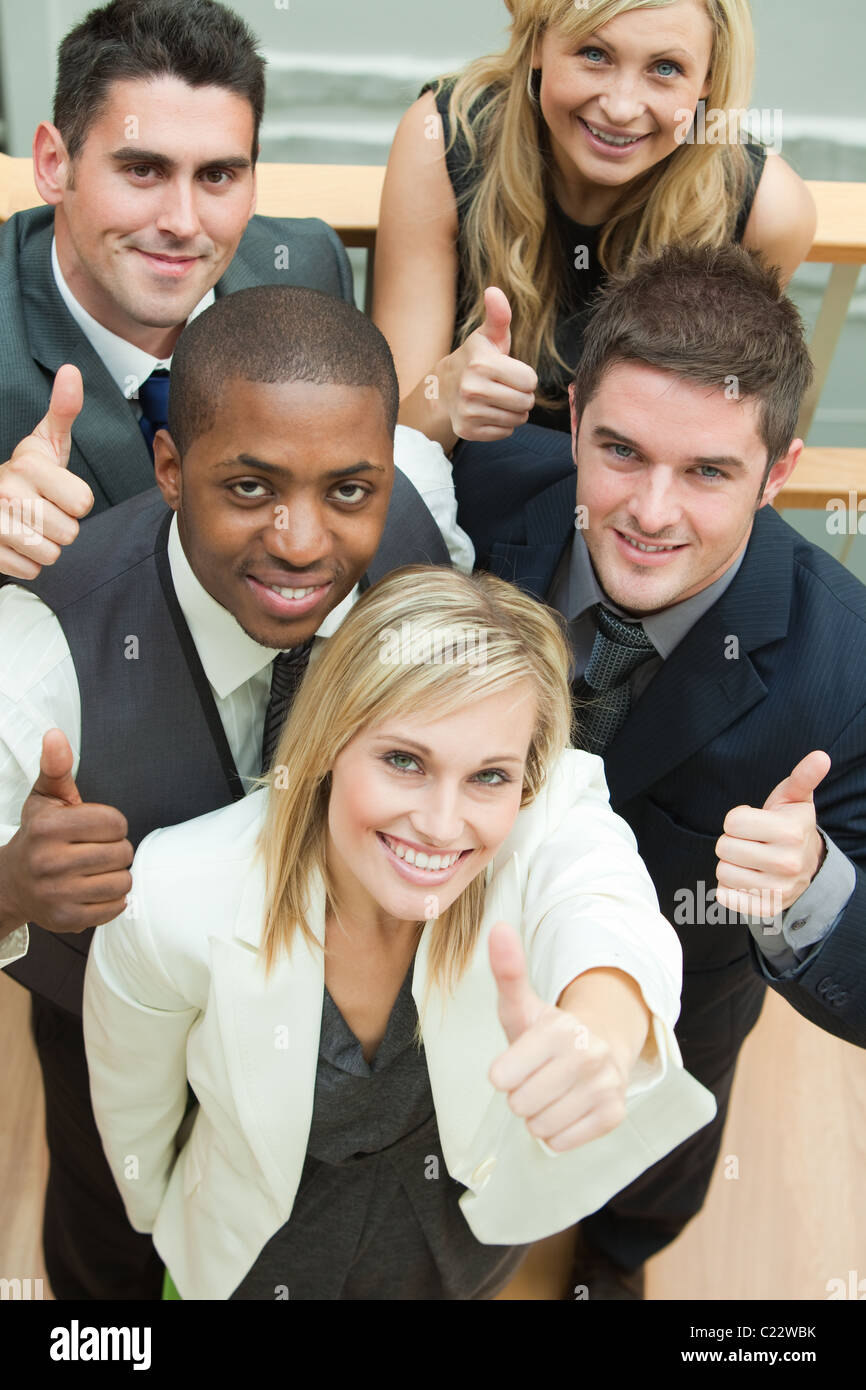 High view of happy business team with thumbs up Stock Photo - Alamy