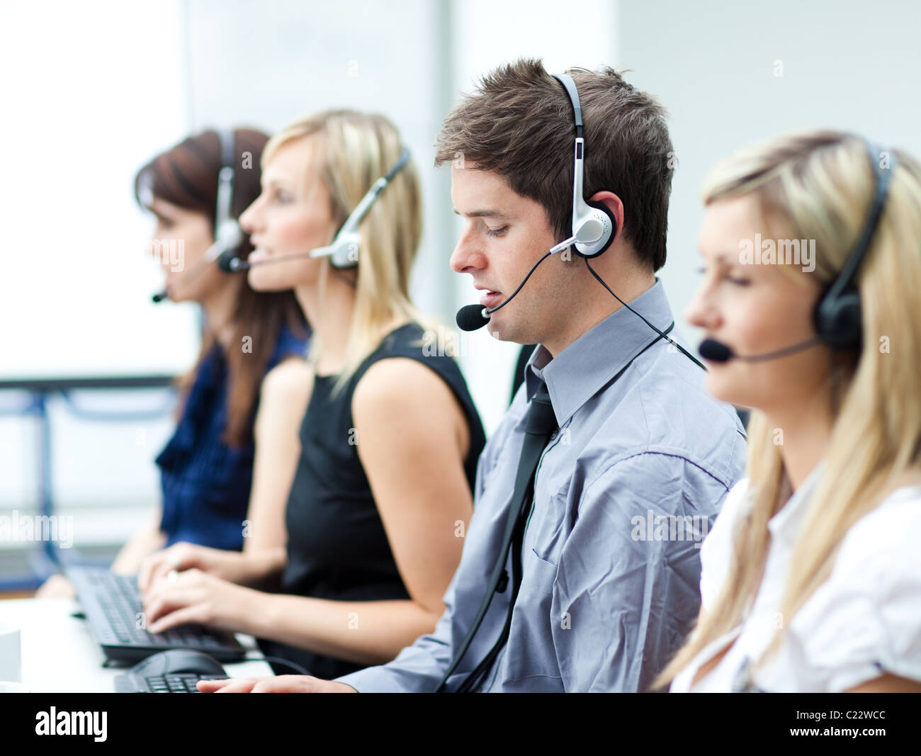 Attractive young man working in a call center Stock Photo