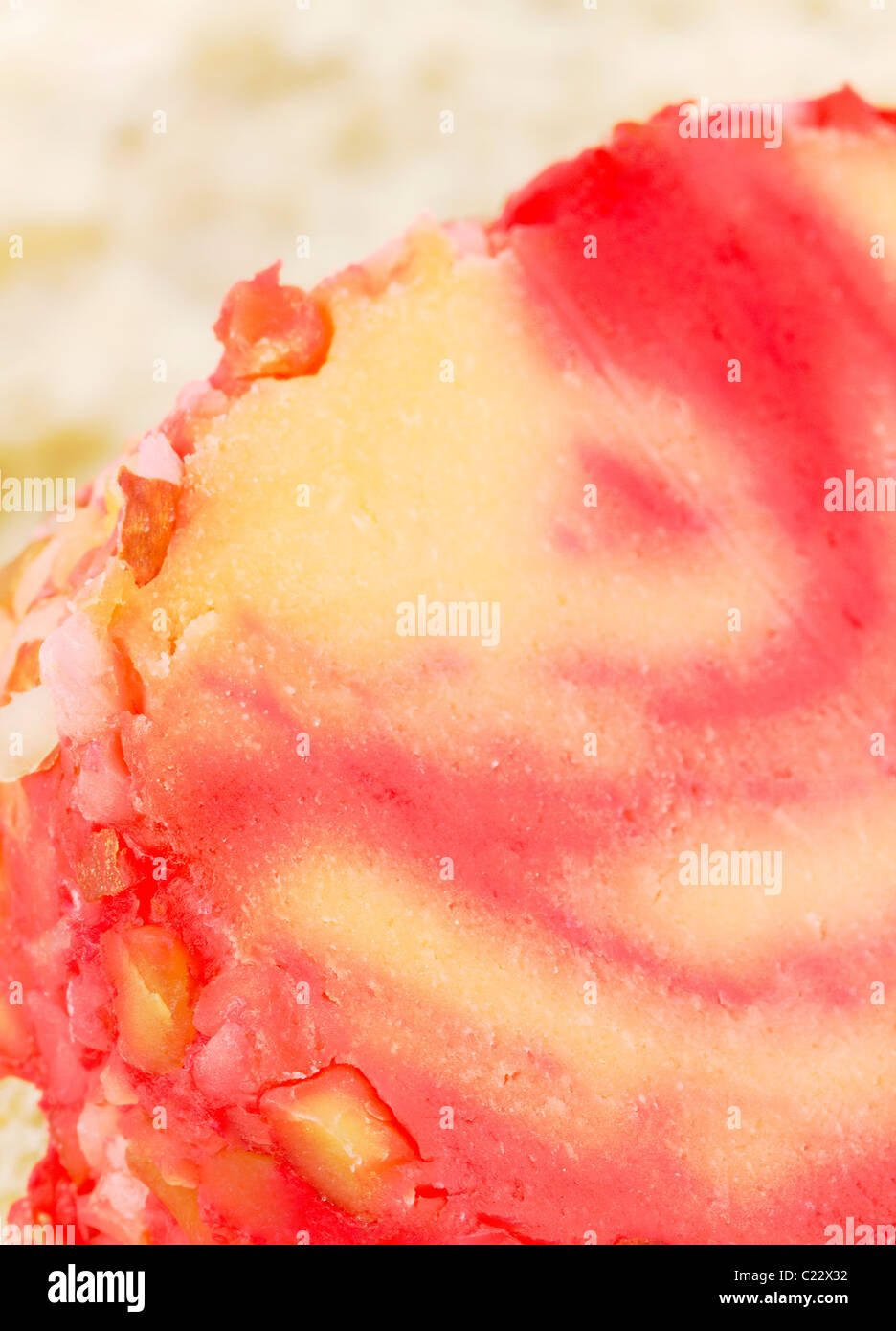 Macro image of a round slice of cheddar cheese swirled with port wine