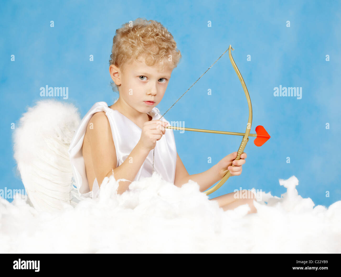 Lovely Emotional Little Boy In A Costume Of Cupid With A Bow And Arrows Of  Love Stock Photo, Picture and Royalty Free Image. Image 37048508.