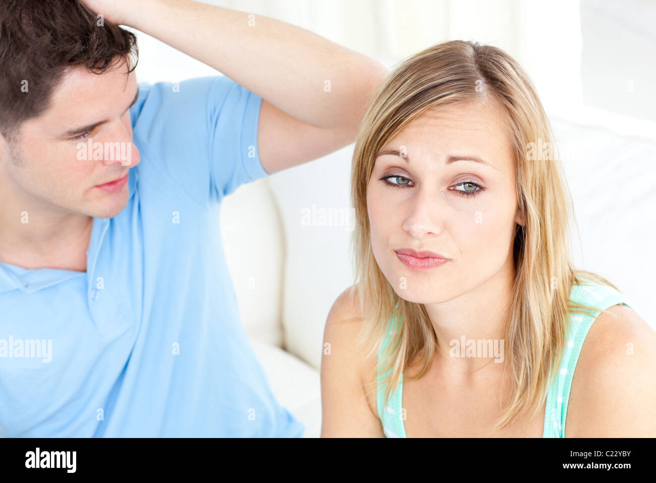 Young couple having an argue in the living-room Stock Photo - Alamy