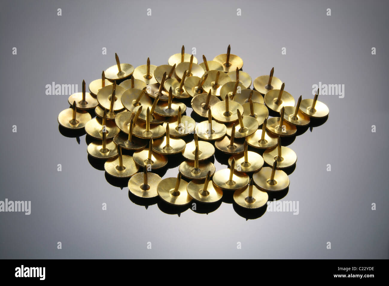 Gold thumbtacks hi-res stock photography and images - Alamy