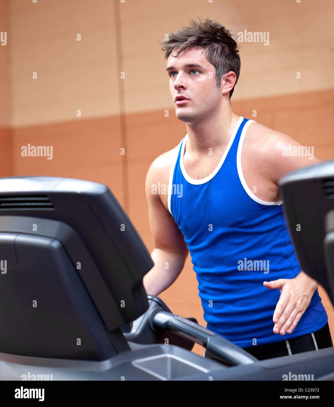 Concentrated athletic man training on a running machine Stock Photo Alamy