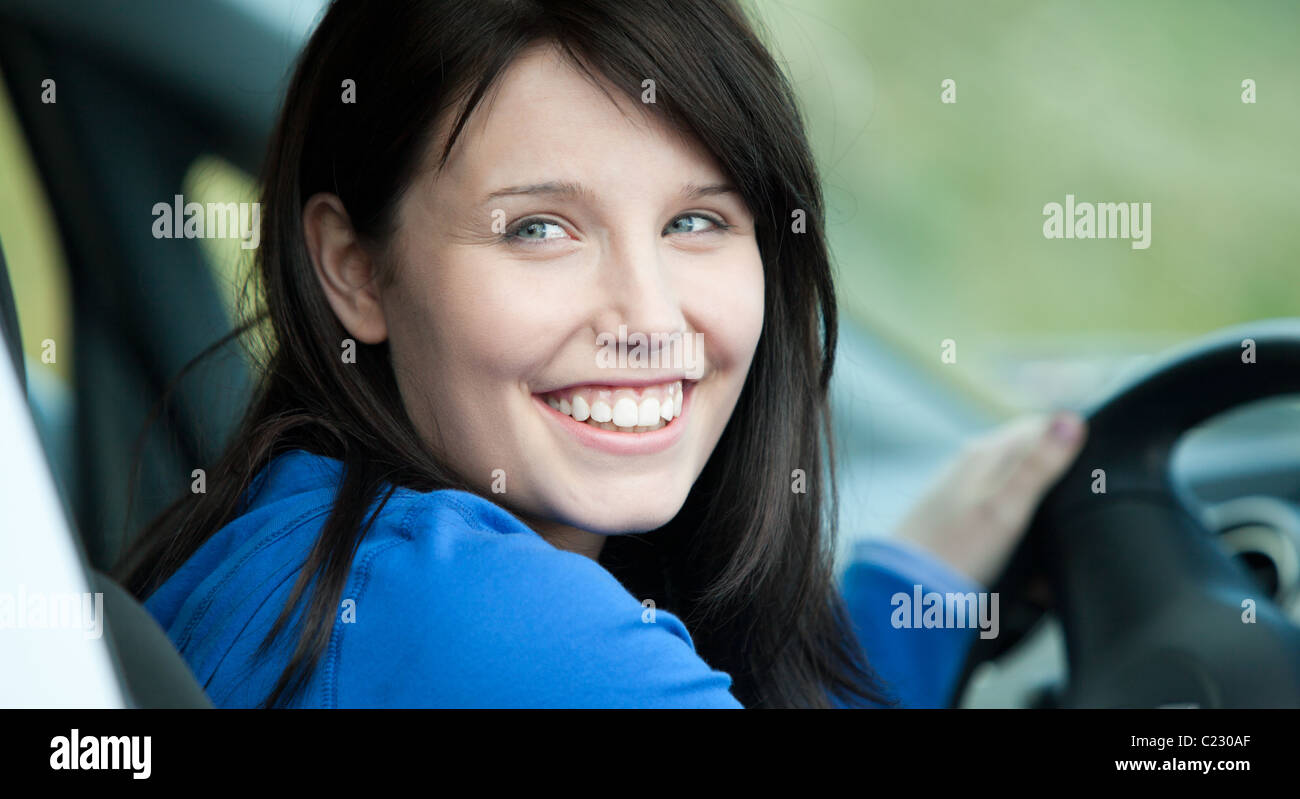 Bright female driver sitting in a car Stock Photo