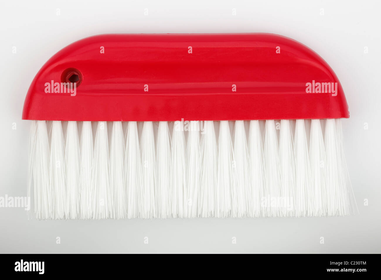 Red wallpaper smoothing brush Stock Photo