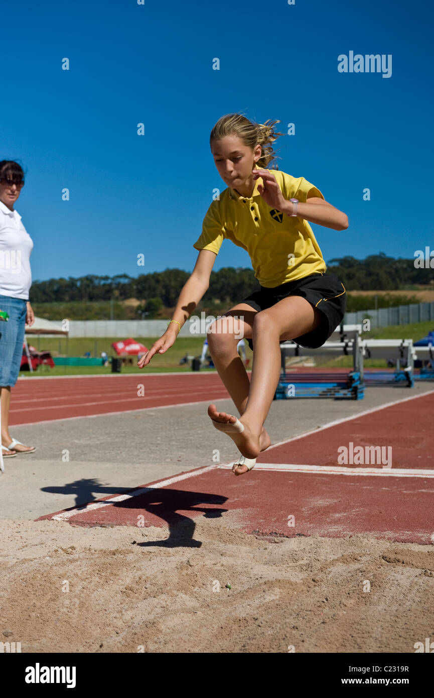 South African school girl in a long jump competition, Bellvile, Western Cape, South Africa Stock Photo