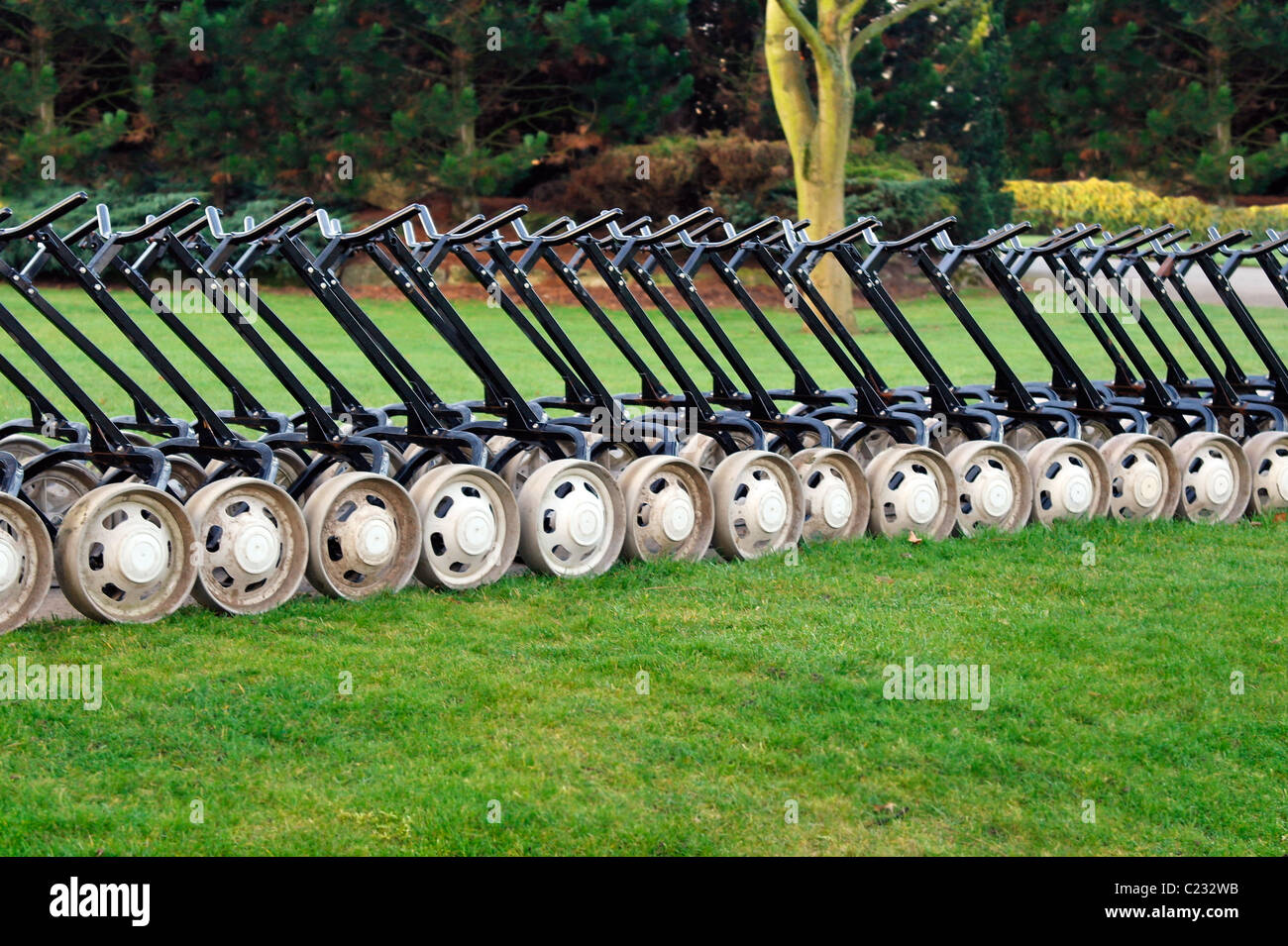 Photo of golf trolleys in a line Stock Photo