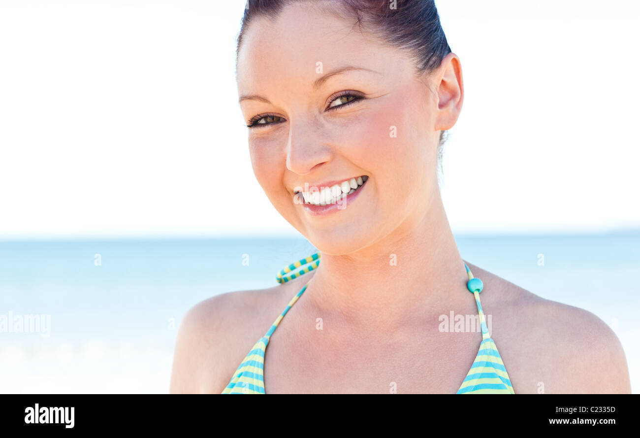 Beautiful young woman smiling at the camera on the beach Stock Photo ...