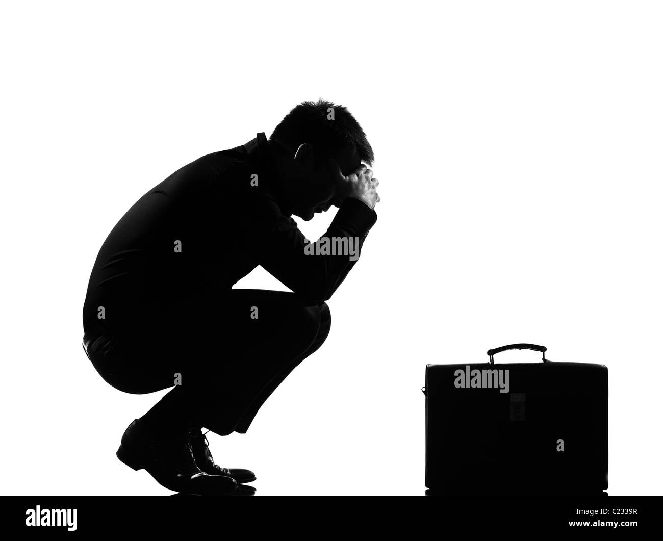 silhouette caucasian business man  expressing fatigue despair tired behavior briefcase  full length on studio isolated Stock Photo